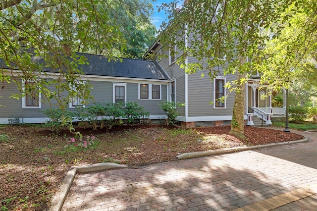 708 E University Ave, Gainesville, FL 32601 - view of front facade with a chimney and a shingled roof