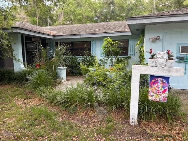 8411 N Pine Needle Ter, Crystal River, FL 34428 - property entrance featuring roof with shingles