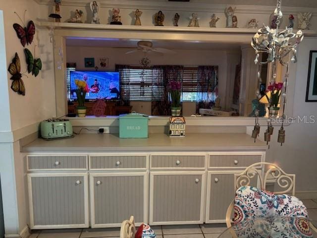 8411 N Pine Needle Ter, Crystal River, FL 34428 - bar area with light tile patterned floors and a chandelier