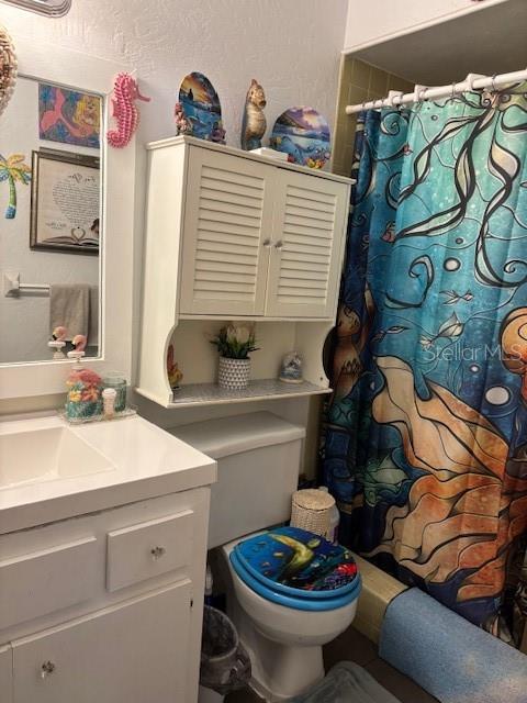 8411 N Pine Needle Ter, Crystal River, FL 34428 - bathroom featuring vanity and a shower with curtain