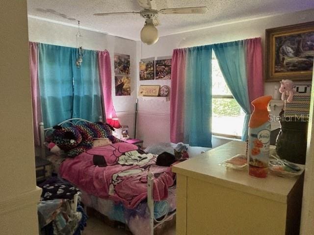 8411 N Pine Needle Ter, Crystal River, FL 34428 - bedroom with a textured ceiling and ceiling fan