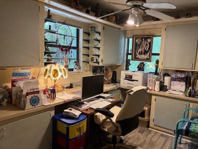 8411 N Pine Needle Ter, Crystal River, FL 34428 - office area with a ceiling fan and wood finished floors