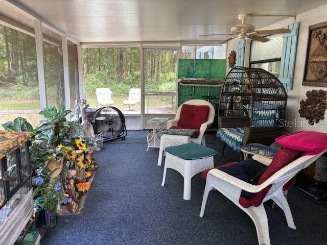 8411 N Pine Needle Ter, Crystal River, FL 34428 - sunroom featuring ceiling fan