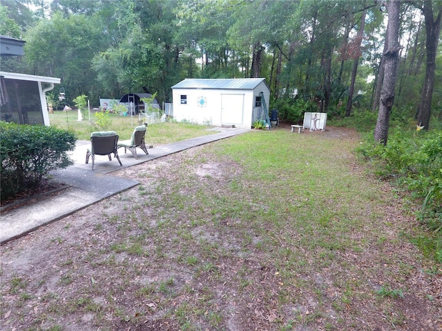 8411 N Pine Needle Ter, Crystal River, FL 34428 - view of grassy yard featuring an outdoor structure