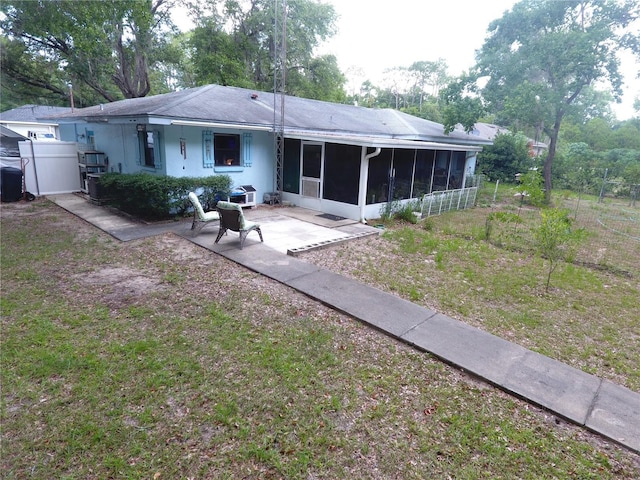 8411 N Pine Needle Ter, Crystal River, FL 34428 - rear view of property featuring a sunroom and a patio