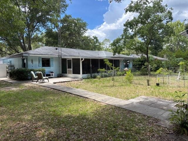8411 N Pine Needle Ter, Crystal River, FL 34428 - rear view of property with a sunroom