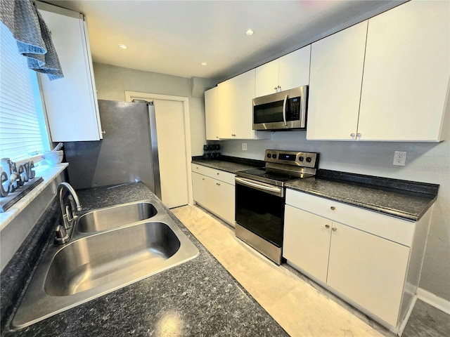 4110 NW 44th Dr Unit 0, Gainesville, FL 32606 - kitchen featuring stainless steel appliances, white cabinetry, dark countertops, and recessed lighting
