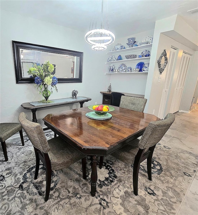 4110 NW 44th Dr Unit 0, Gainesville, FL 32606 - dining room featuring a chandelier