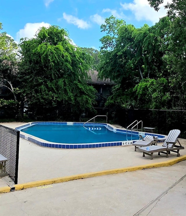4110 NW 44th Dr Unit 0, Gainesville, FL 32606 - community pool with a patio