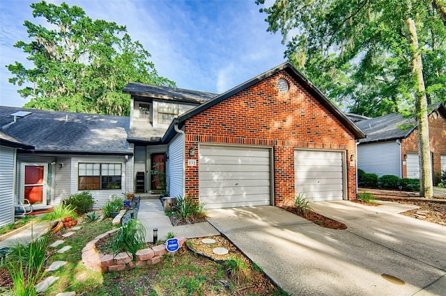 832 NW 42nd Ter, Gainesville, FL 32605 - traditional-style house featuring concrete driveway, an attached garage, and brick siding