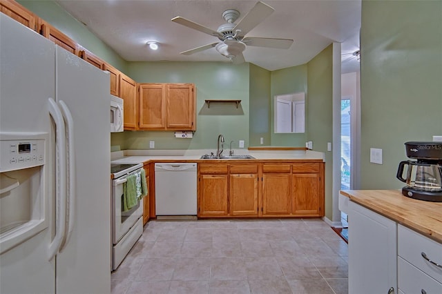 832 NW 42nd Ter, Gainesville, FL 32605 - kitchen with white appliances, light countertops, and a ceiling fan