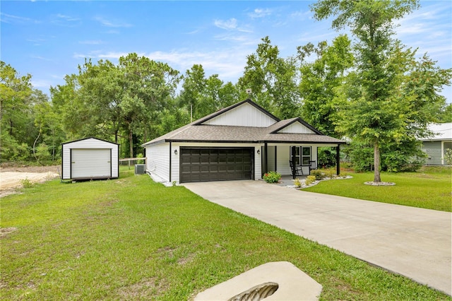 15591 NE 14th Pl, Williston, FL 32696 - modern farmhouse style home with a front lawn, an attached garage, covered porch, concrete driveway, and a storage shed