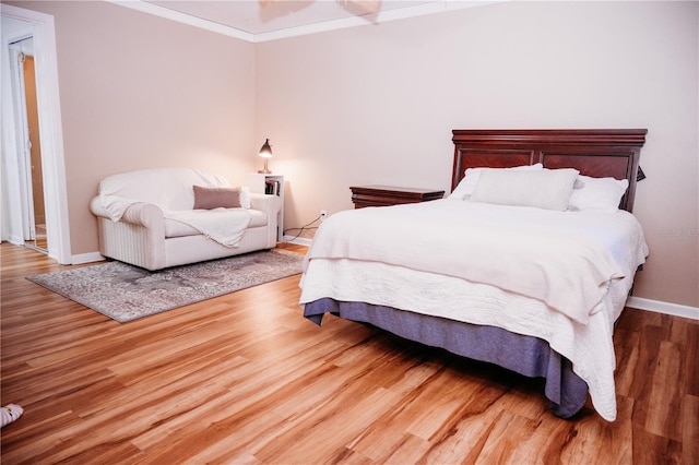 9835 NW 6th Pl, Gainesville, FL 32607 - bedroom featuring wood finished floors and crown molding