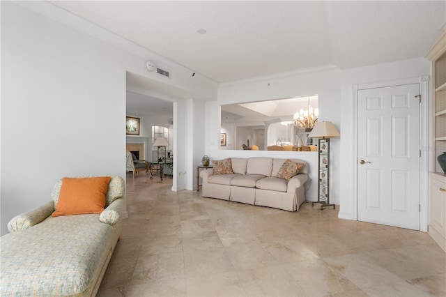 604 Ocean Club Ct, Fernandina Beach, FL 32034 - living room featuring a chandelier, a fireplace, and crown molding