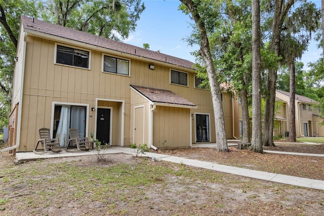507 NW 39th Rd Unit 320, Gainesville, FL 32607 - townhome / multi-family property featuring a shingled roof