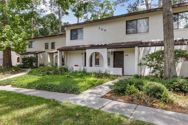 2635 SW 35th Pl Unit 304, Gainesville, FL 32608 - view of property with stucco siding
