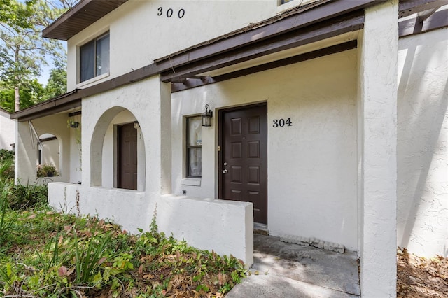 2635 SW 35th Pl Unit 304, Gainesville, FL 32608 - property entrance featuring stucco siding