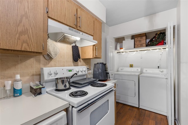 2635 SW 35th Pl Unit 304, Gainesville, FL 32608 - kitchen featuring white electric stove, under cabinet range hood, independent washer and dryer, light countertops, and tasteful backsplash