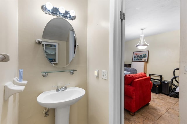 2635 SW 35th Pl Unit 304, Gainesville, FL 32608 - bathroom featuring tile patterned flooring and a sink