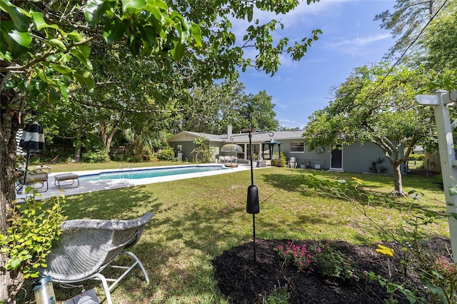 2223 NW 21st Ave, Gainesville, FL 32605 - view of green lawn featuring an outdoor pool and a patio area
