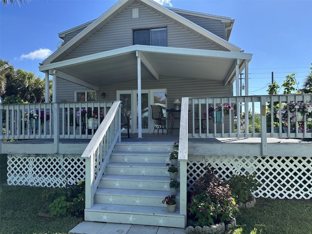 1536 S Central Ave, Flagler Beach, FL 32136 - view of front of home with a deck and a carport