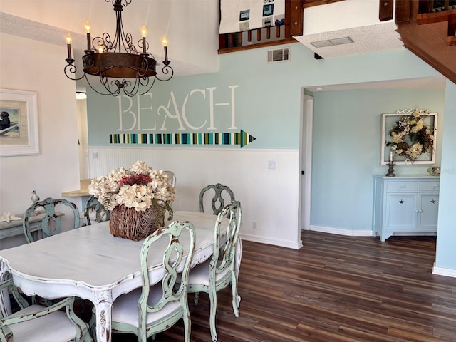 1536 S Central Ave, Flagler Beach, FL 32136 - dining area with dark wood-style floors and a chandelier