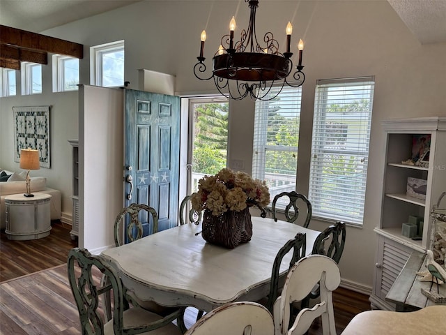 1536 S Central Ave, Flagler Beach, FL 32136 - dining area featuring a chandelier, wood finished floors, and high vaulted ceiling