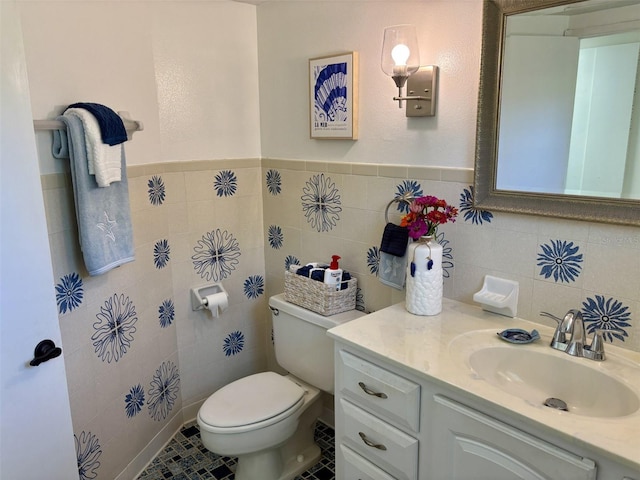 1536 S Central Ave, Flagler Beach, FL 32136 - bathroom with tile walls, vanity, and a wainscoted wall