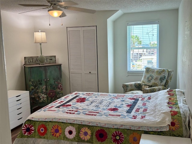 1536 S Central Ave, Flagler Beach, FL 32136 - bedroom featuring a closet, wood finished floors, ceiling fan, and a textured ceiling