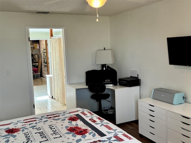 1536 S Central Ave, Flagler Beach, FL 32136 - bedroom featuring wood finished floors and a textured ceiling
