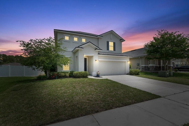 1011 Wetland Ridge Cir, Middleburg, FL 32068 - traditional-style house featuring stucco siding, a garage, and driveway