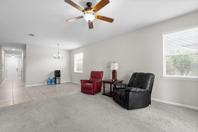 1011 Wetland Ridge Cir, Middleburg, FL 32068 - living area with a chandelier, ceiling fan, carpet flooring, and tile patterned floors