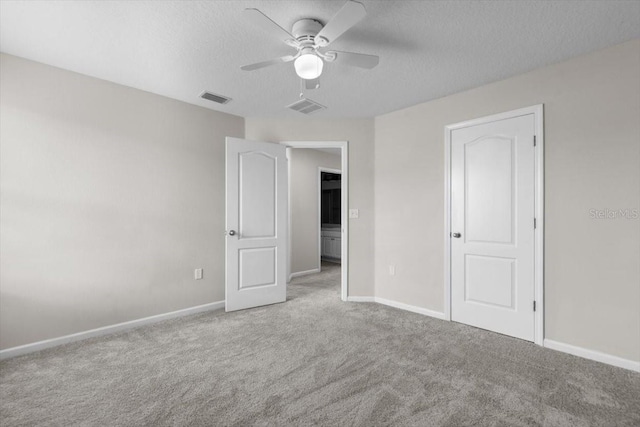 1011 Wetland Ridge Cir, Middleburg, FL 32068 - unfurnished bedroom featuring carpet flooring, a textured ceiling, and ceiling fan