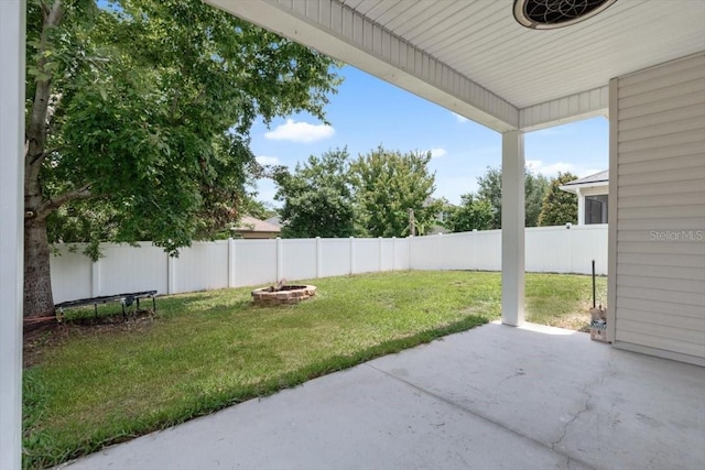 1011 Wetland Ridge Cir, Middleburg, FL 32068 - fenced backyard featuring a patio and an outdoor fire pit