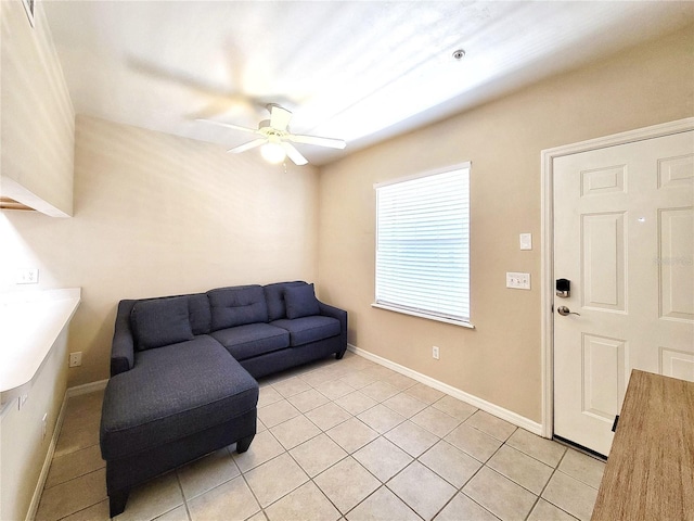 1220 SW 1st Ave Unit 304, Gainesville, FL 32601 - living area featuring ceiling fan and light tile patterned floors