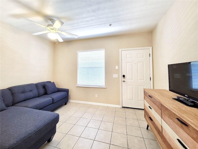 1220 SW 1st Ave Unit 304, Gainesville, FL 32601 - living area with light tile patterned flooring and ceiling fan