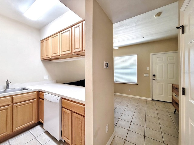 1220 SW 1st Ave Unit 304, Gainesville, FL 32601 - kitchen with dishwasher, light tile patterned floors, light brown cabinetry, and light countertops