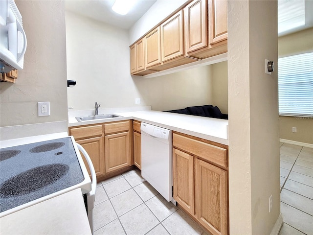 1220 SW 1st Ave Unit 304, Gainesville, FL 32601 - kitchen with white appliances, light tile patterned flooring, light brown cabinetry, and light countertops
