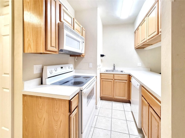 1220 SW 1st Ave Unit 304, Gainesville, FL 32601 - kitchen featuring white appliances, light tile patterned flooring, light countertops, and light brown cabinets
