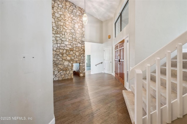 110 Cypress St, Hawthorne, FL 32640 - entryway with a high ceiling, stairway, wood finished floors, and a chandelier