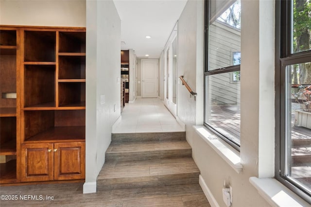 110 Cypress St, Hawthorne, FL 32640 - hall featuring healthy amount of natural light, recessed lighting, and wood finished floors