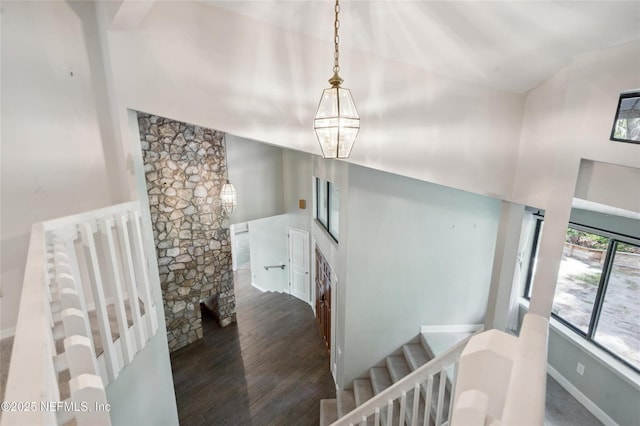 110 Cypress St, Hawthorne, FL 32640 - staircase featuring wood finished floors and a towering ceiling