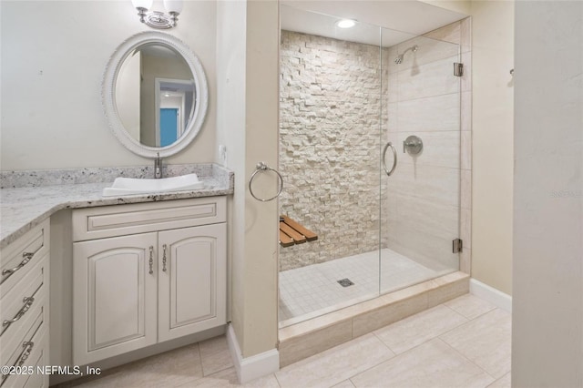 110 Cypress St, Hawthorne, FL 32640 - full bath with vanity, a stall shower, and tile patterned flooring