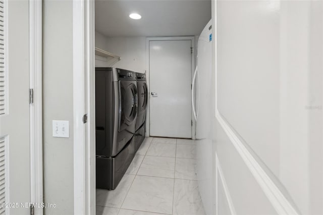 110 Cypress St, Hawthorne, FL 32640 - laundry room with washing machine and clothes dryer, light marble finish floors, and recessed lighting