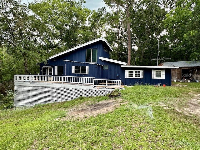 9947 SW 37th St, Lake Butler, FL 32054 - view of front of house with a deck and a front lawn