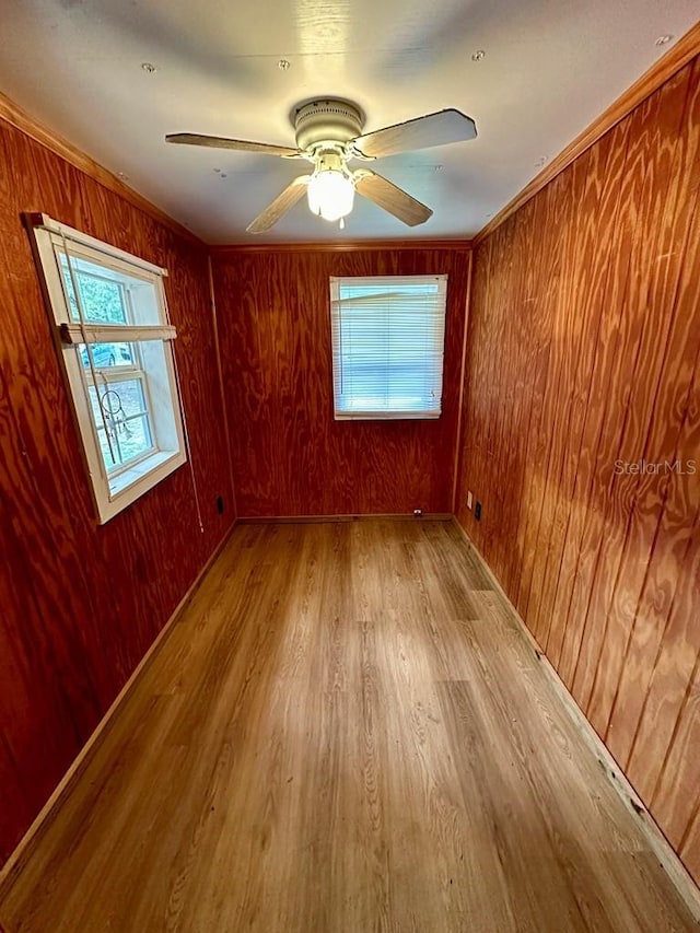 9947 SW 37th St, Lake Butler, FL 32054 - spare room with wood finished floors, wooden walls, and a ceiling fan