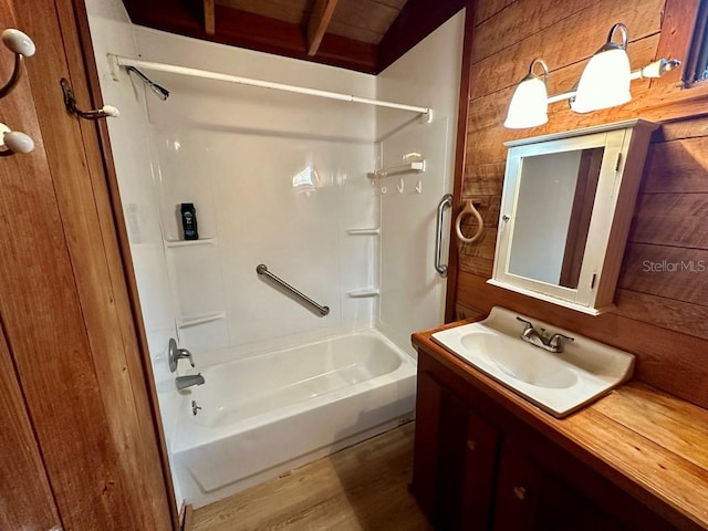 9947 SW 37th St, Lake Butler, FL 32054 - bathroom with shower / bath combination, vanity, wood finished floors, and wood walls