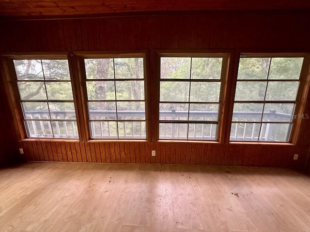 9947 SW 37th St, Lake Butler, FL 32054 - spare room with wood-type flooring, plenty of natural light, and wood walls