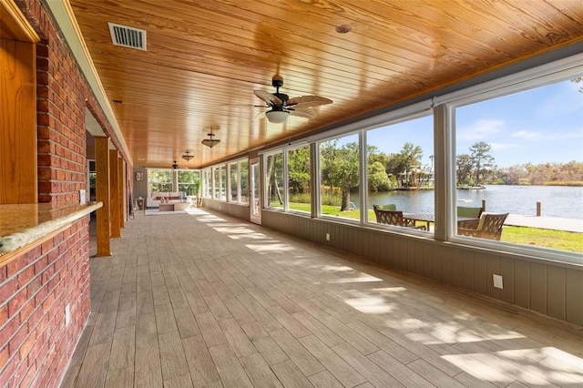 900 NW Snug Harbor Rd, Crystal River, FL 34428 - unfurnished sunroom with a water view and a ceiling fan