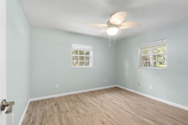 900 NW Snug Harbor Rd, Crystal River, FL 34428 - spare room with light wood-style flooring and a ceiling fan